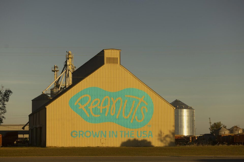 Farm building with Peanuts logo on the side of it
