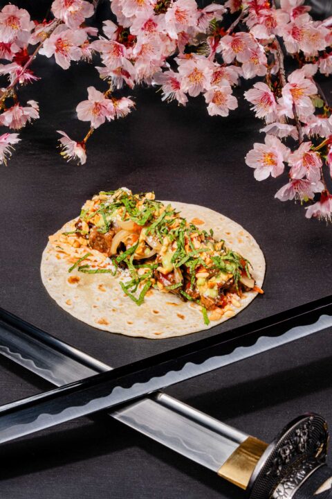 a plate surrounded by flowers and a ronin blade