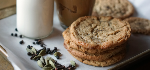 a plate of cookies and a glass of milk.