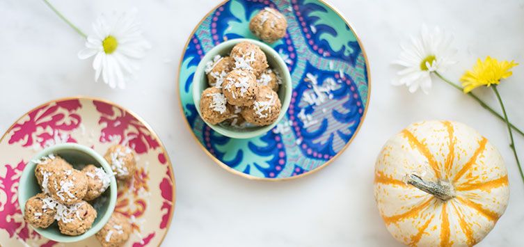 two bowls full of bite-sized peanut balls.